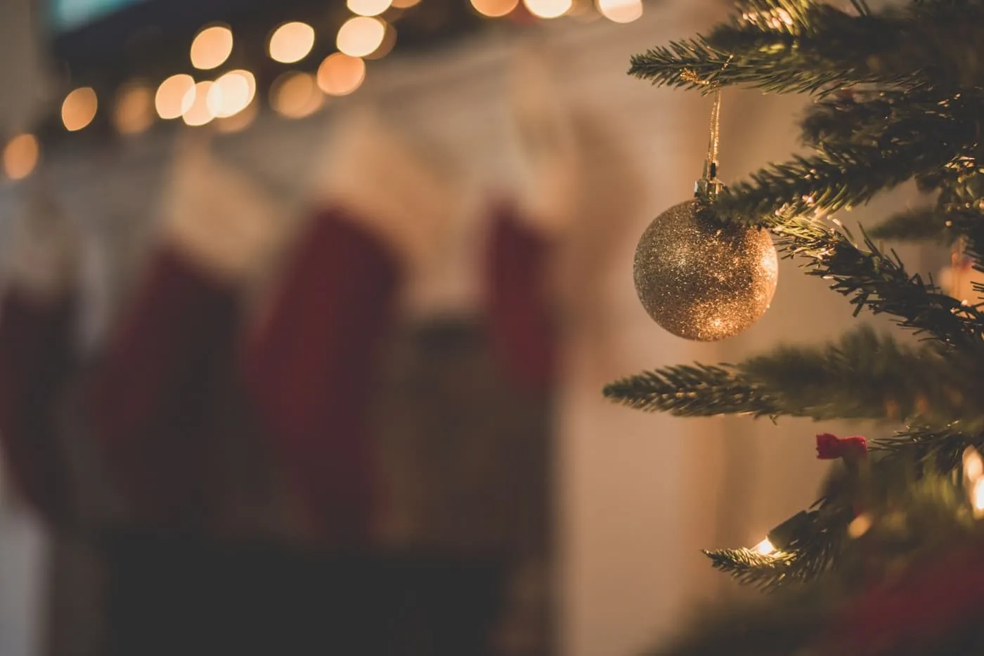 Australian outdoor Christmas setting with shade sail, white table, and fresh native foliage centrepiece