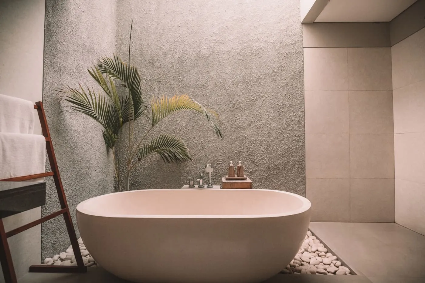 Bathroom shelf styled with rattan basket, white ceramic soap dish, and a pothos plant