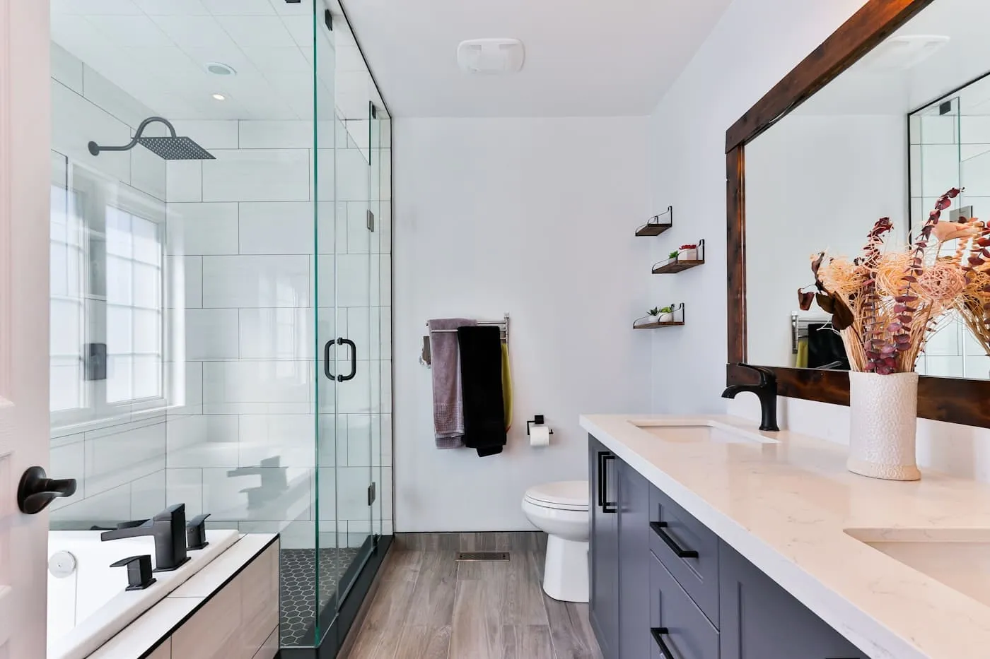 Zellige tile feature wall in soft white with brushed nickel fittings in a coastal bathroom